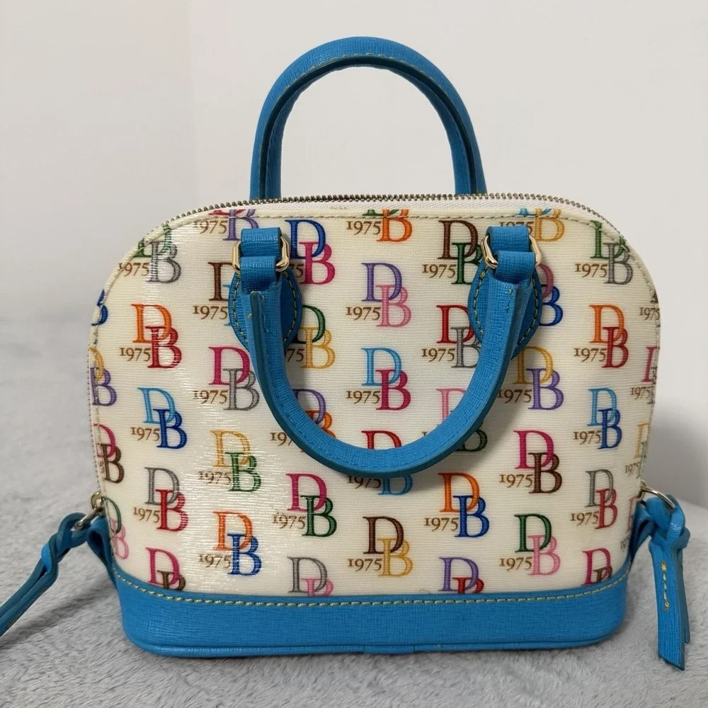 Dooney & Bourke 1975 Logo Bag Domed Crossbody Ruby Top Handle Wht/ Multi Zip Top - Picture 2 of 12